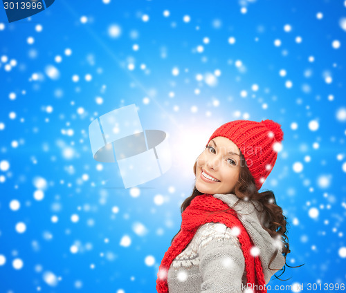 Image of smiling young woman in winter clothes