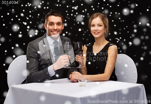 Image of smiling couple at restaurant