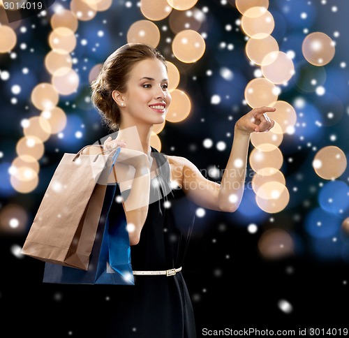 Image of smiling woman with shopping bags