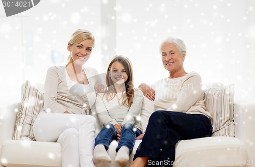 Image of smiling family at home