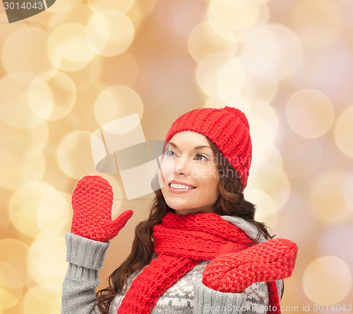 Image of smiling young woman in winter clothes