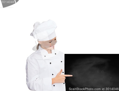 Image of smiling female chef with white blank board