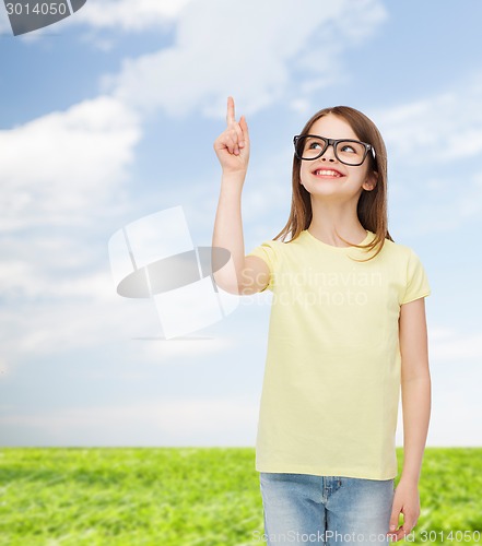 Image of smiling cute little girl in black eyeglasses