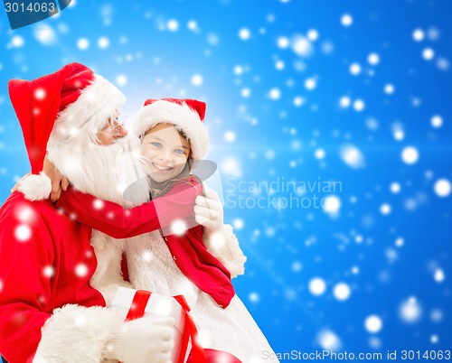 Image of smiling little girl with santa claus