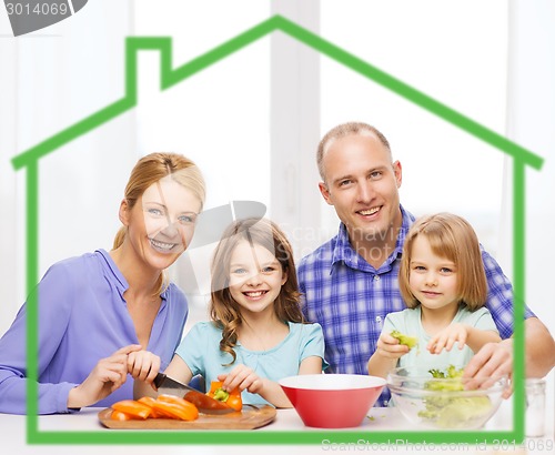 Image of happy family with two kids making dinner at home