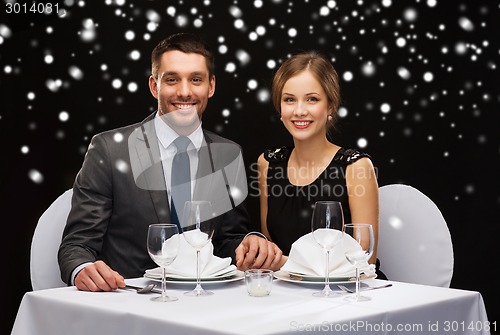 Image of smiling couple at restaurant