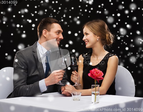 Image of smiling couple at restaurant