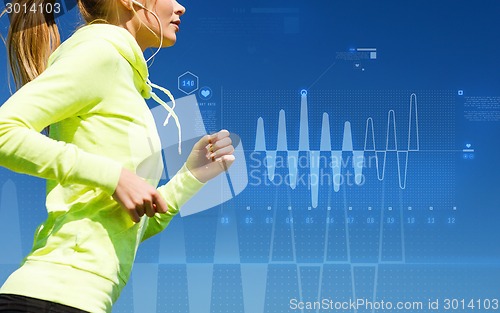 Image of smiling woman doing running outdoors
