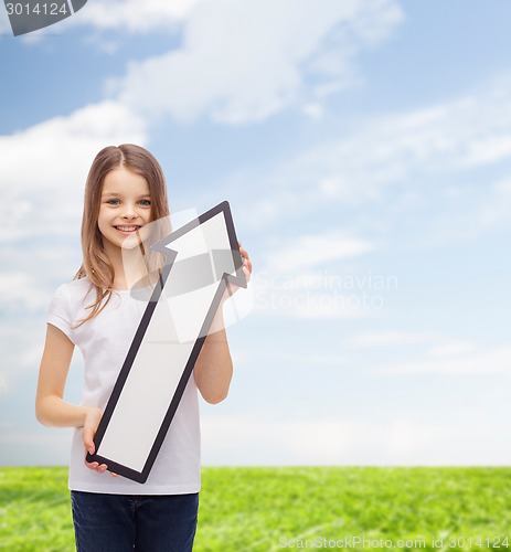 Image of smiling little girl with blank arrow pointing up