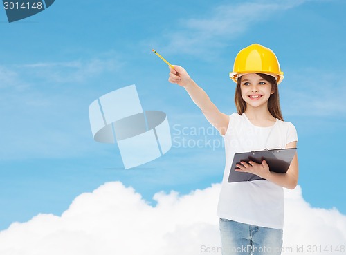 Image of smiling little girl in hardhat with clipboard
