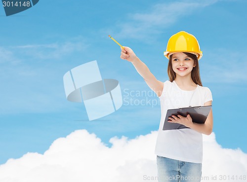 Image of smiling little girl in hardhat with clipboard