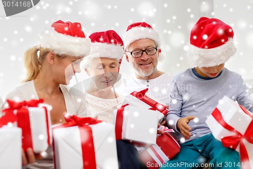 Image of happy family sitting on couch at home