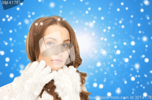 Image of smiling young woman in winter clothes