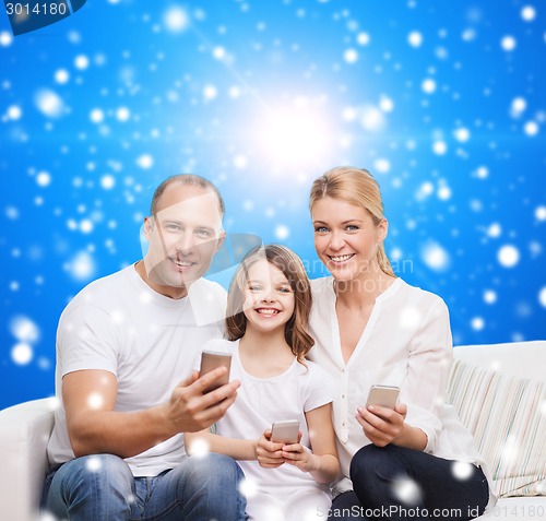 Image of happy family with smartphones