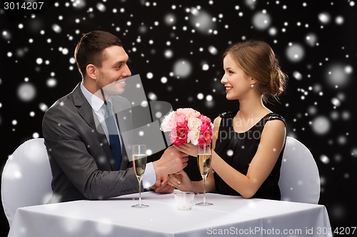 Image of smiling couple at restaurant