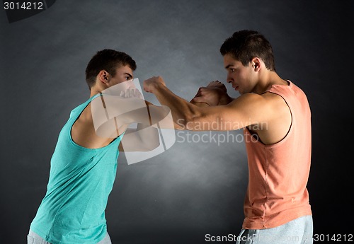 Image of young men wrestling