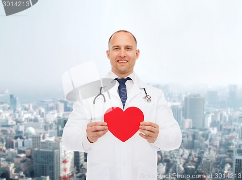 Image of smiling male doctor with red heart and stethoscope