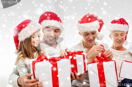 Image of happy family sitting on couch at home