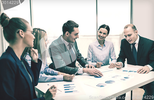 Image of smiling business team at meeting