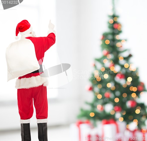 Image of man in costume of santa claus with bag