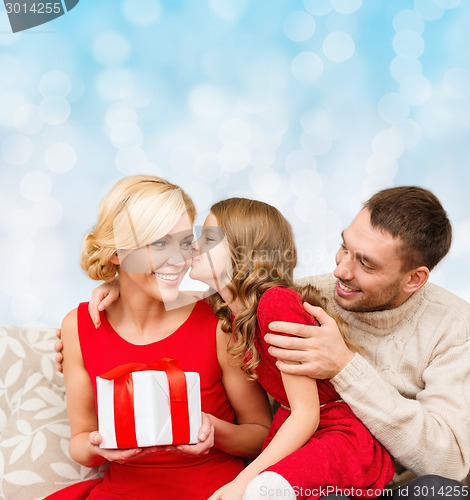 Image of happy family with gift box