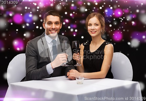 Image of smiling couple at restaurant