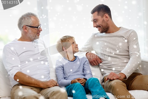 Image of smiling family at home