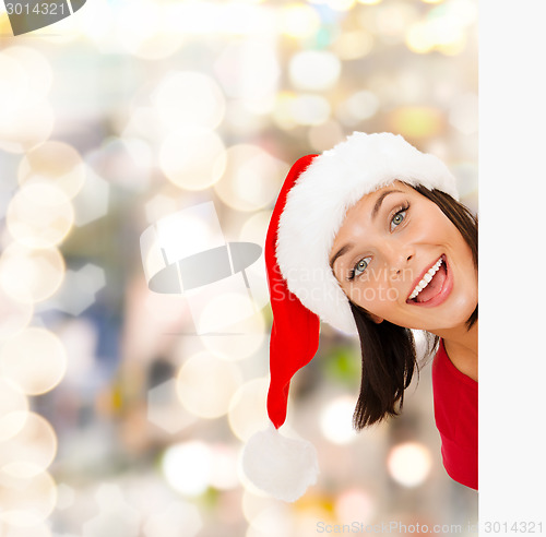 Image of woman in santa helper hat with blank white board