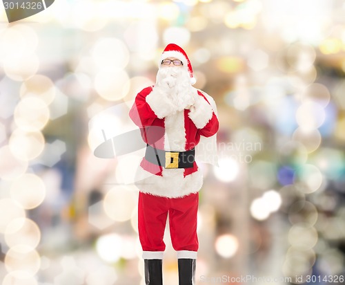 Image of man in costume of santa claus with bag