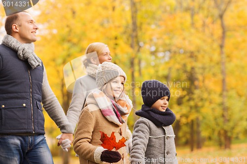 Image of happy family in autumn park