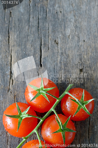 Image of  ripe cherry tomatoes on wood