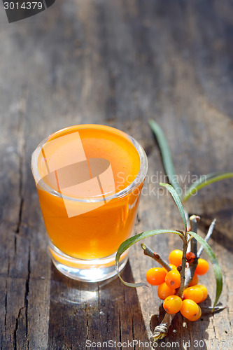 Image of Sea buckthorn juice and berries