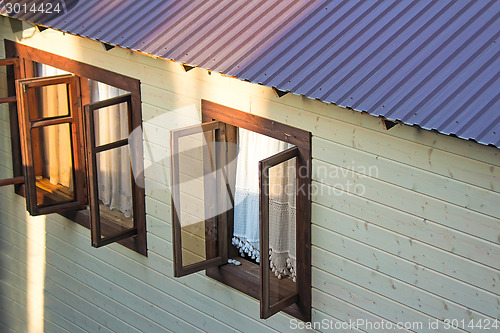 Image of Detail of the facade of the house with Windows.