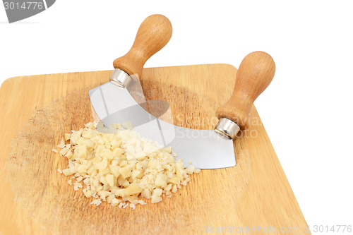 Image of Finely chopped macadamia nuts with a rocking knife