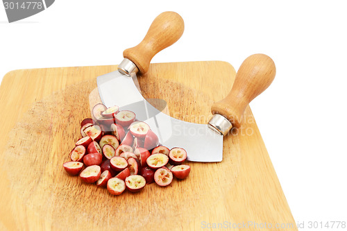 Image of Chopped fresh cranberries with a rocking knife