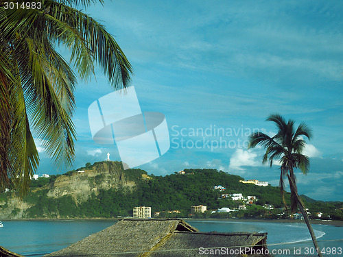 Image of beach landscape San Juan del Sur Nicaragua with statue Jesus Chr