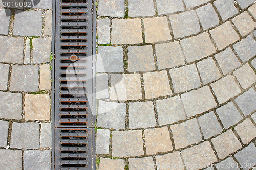 Image of drainage on stone paved street