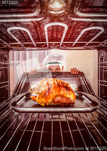 Image of Cooking chicken in the oven.