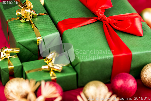Image of Four Xmas Presents in Plain Green