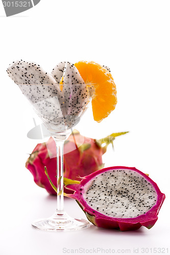 Image of Wedges of a pitaya in a glass
