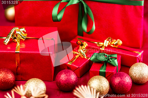 Image of Five Xmas Gifts Wrapped in Plain Red