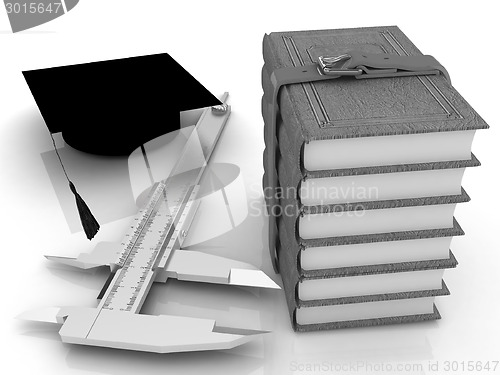 Image of Vernier caliper, books and graduation hat. The best professional