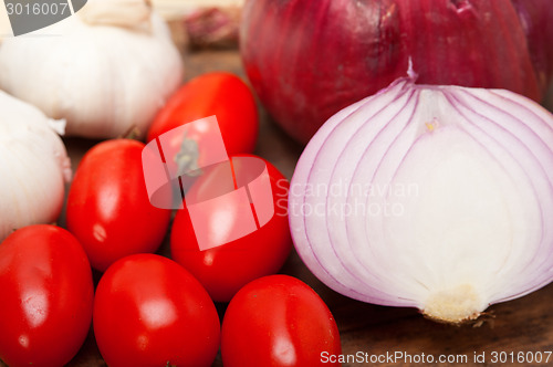 Image of onion garlic and tomatoes
