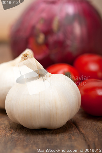 Image of onion garlic and tomatoes