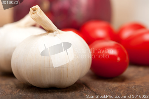 Image of onion garlic and tomatoes