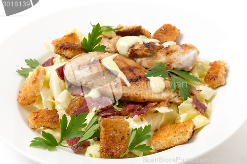 Image of Chicken caesar salad side view