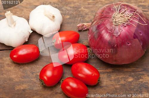 Image of onion garlic and tomatoes