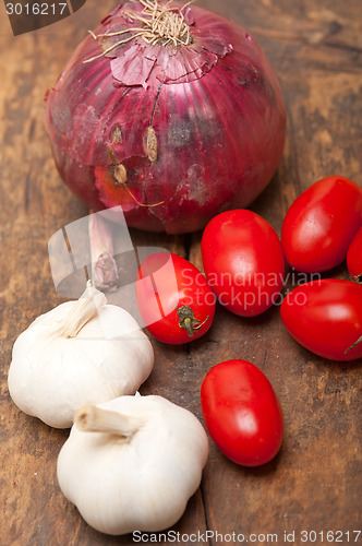 Image of onion garlic and tomatoes