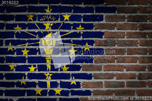 Image of Brick wall texture with flag