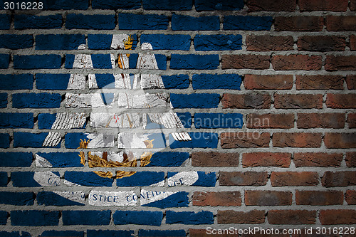 Image of Brick wall texture with flag